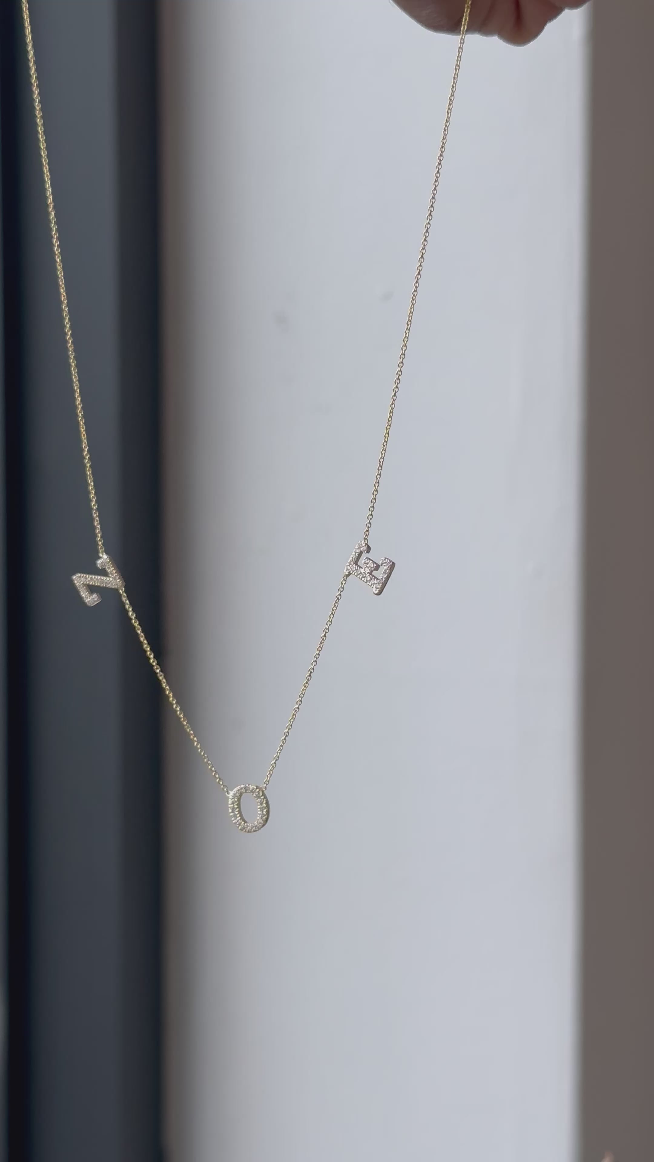 Hanging Initial name necklace with diamonds in 14kt yellow gold (18” chain)