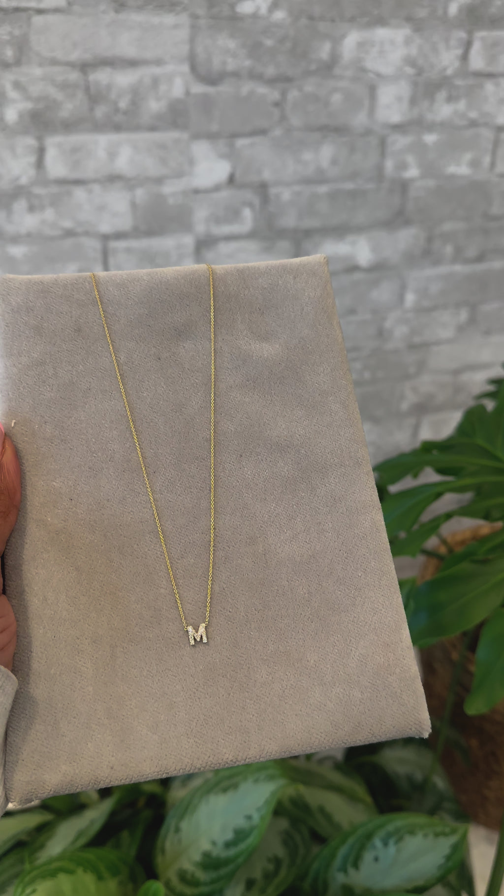 Hanging initial charm necklace with diamonds